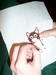 Cat in needlepoint; Size=180 pixels wide